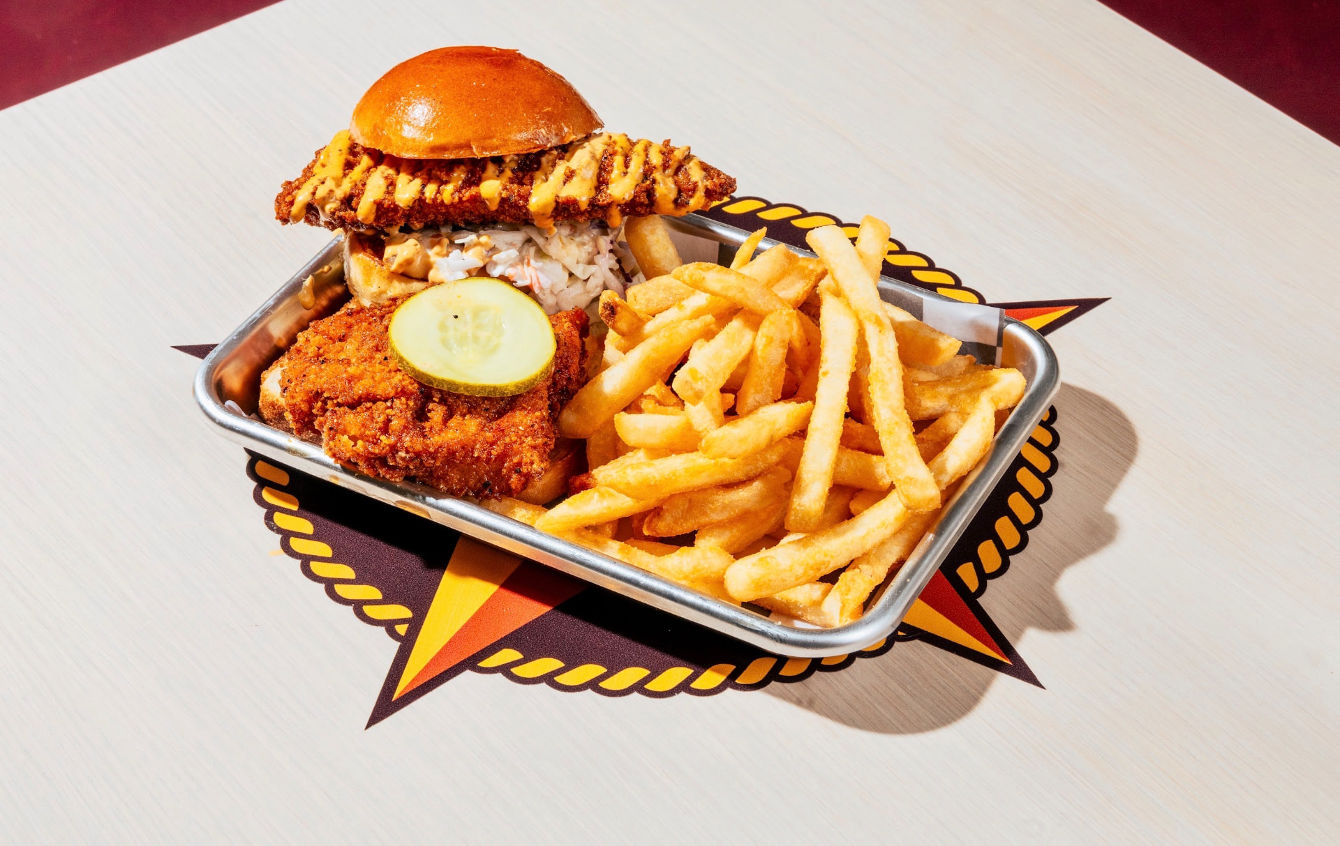 Chicken slider combo with fries and a pickle
