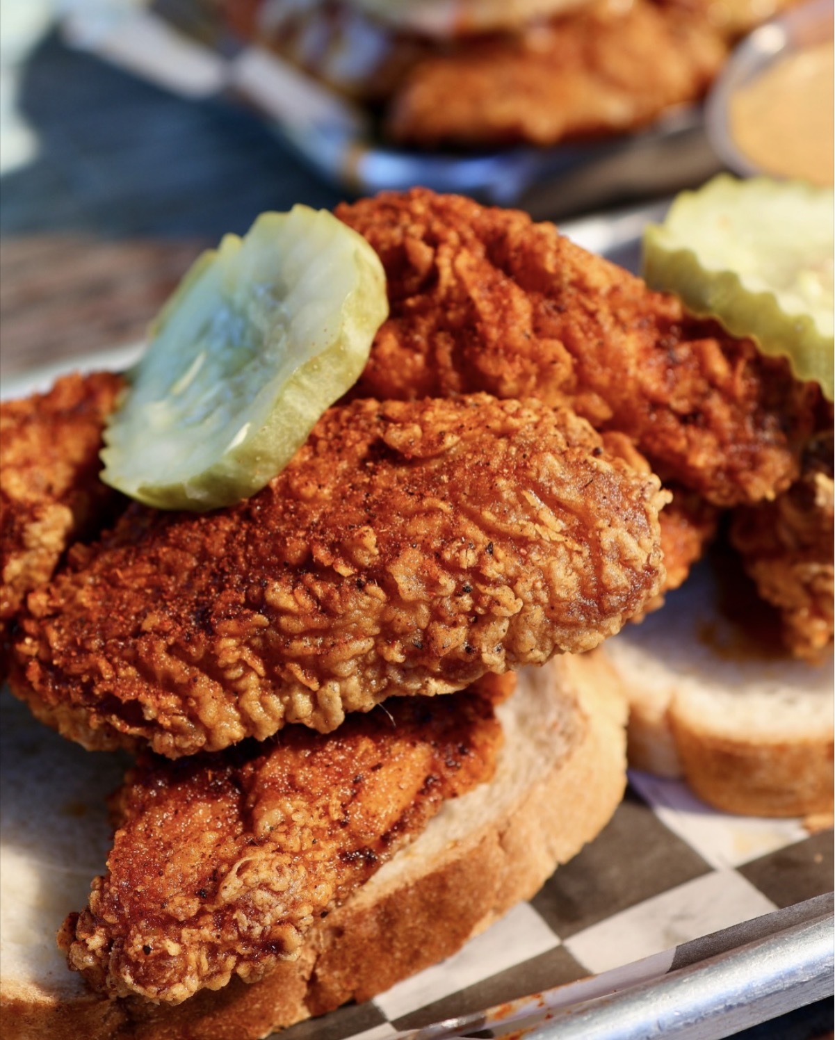 Hotbirds crispy Nashville hot chicken tenders on Texas toast with pickles