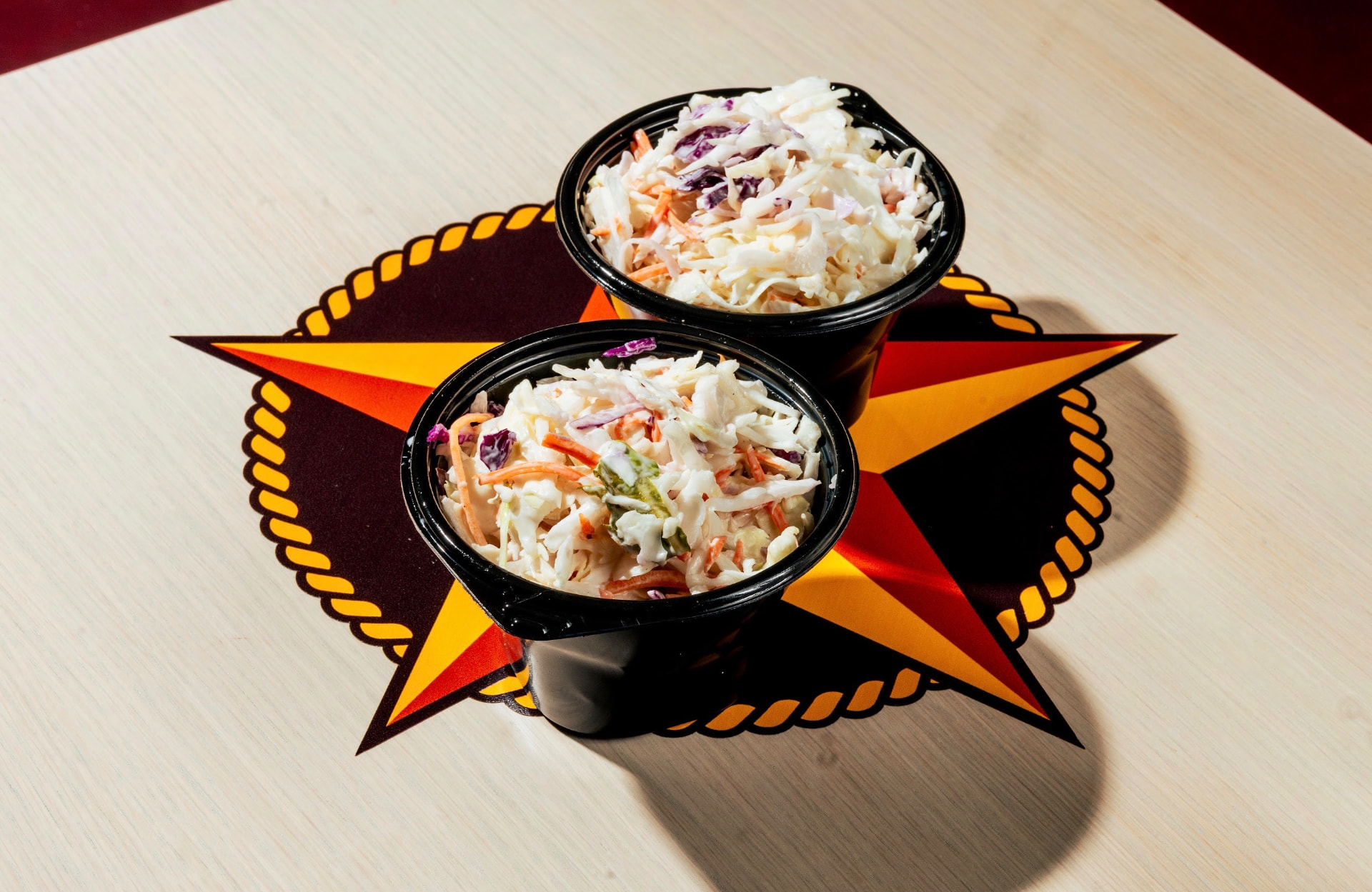 Two bowls of creamy Hotbirds coleslaw