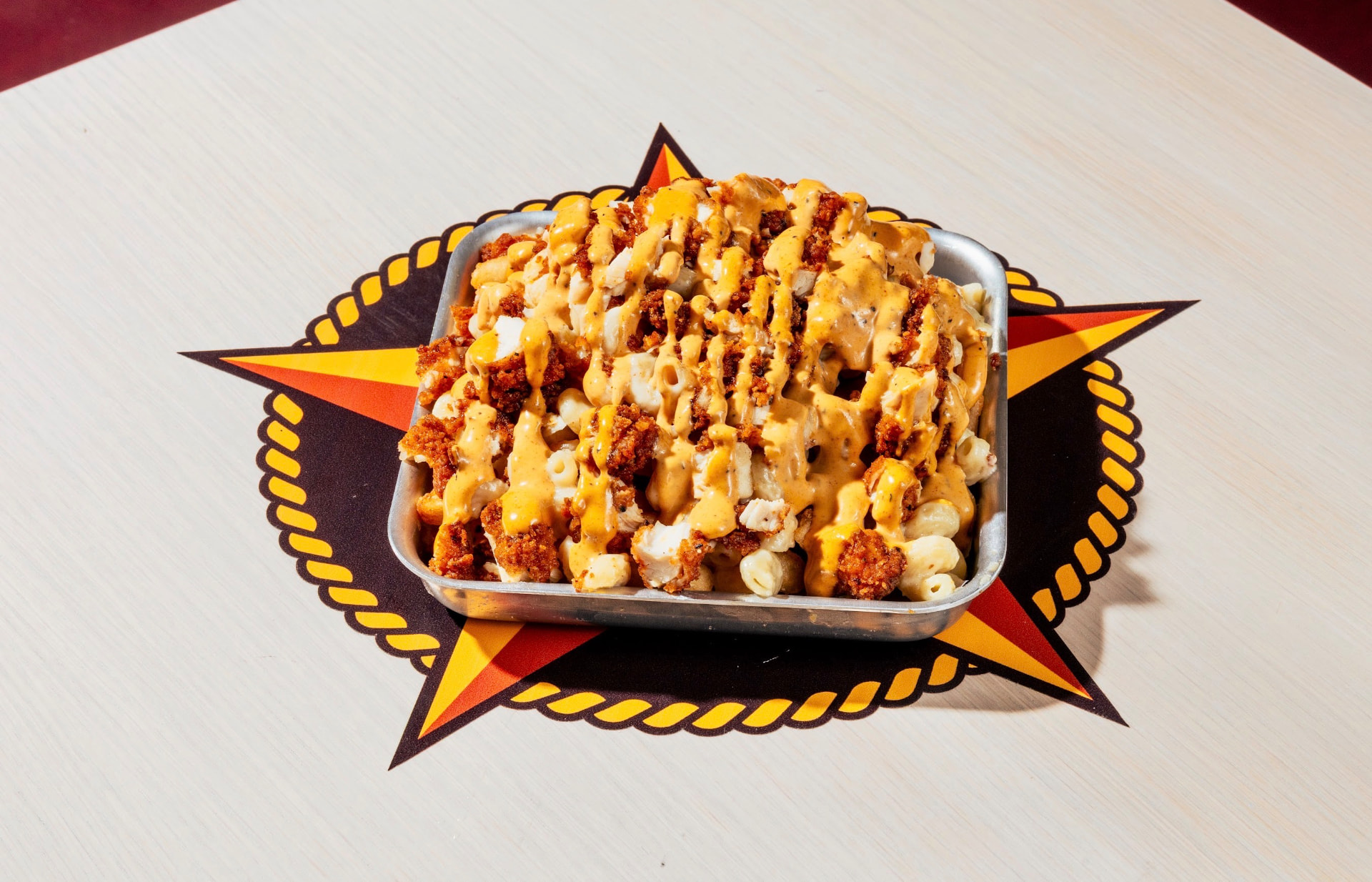 Loaded mac and cheese topped with hot chicken