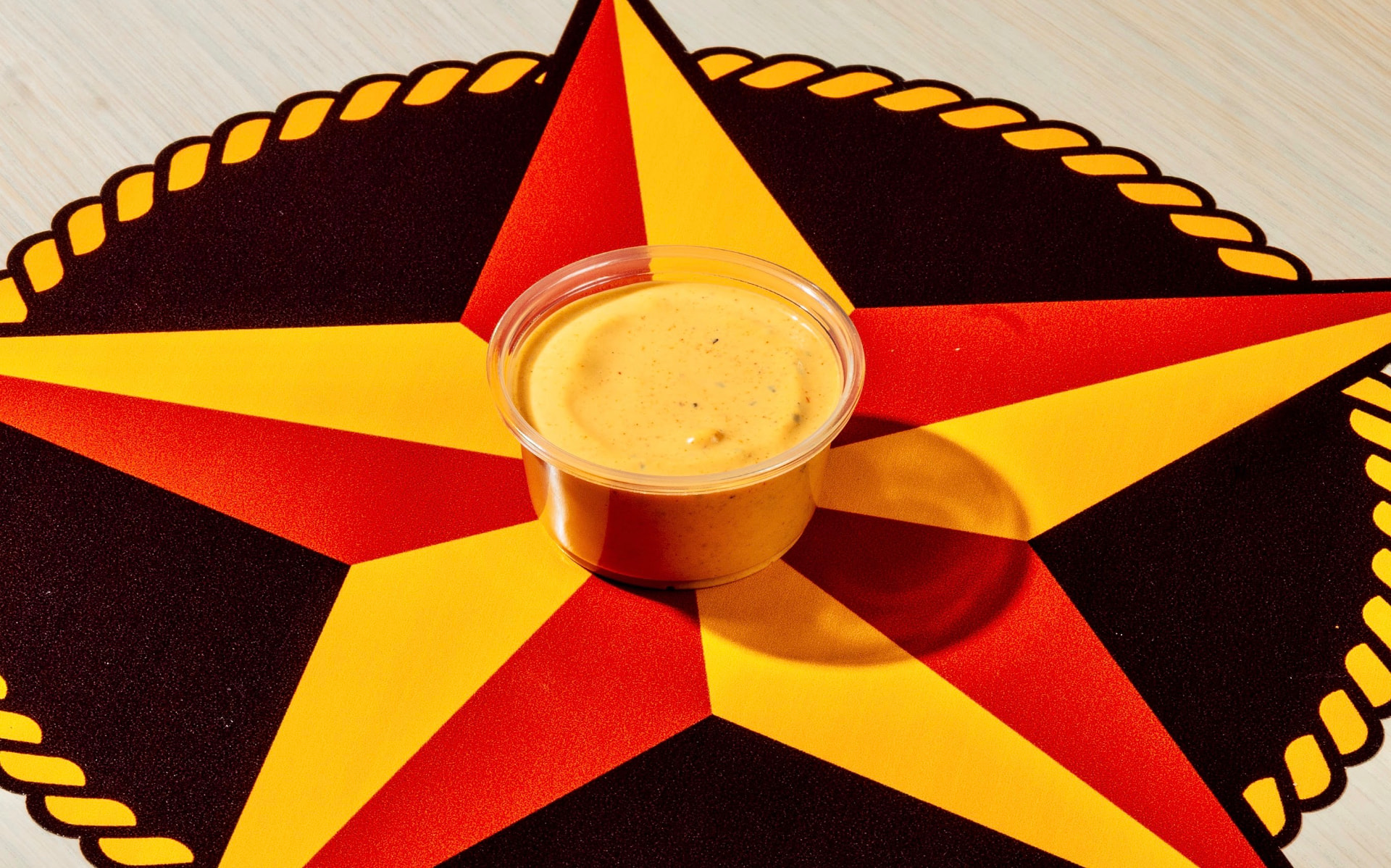 Cup of Hotbirds comeback sauce on the brand star