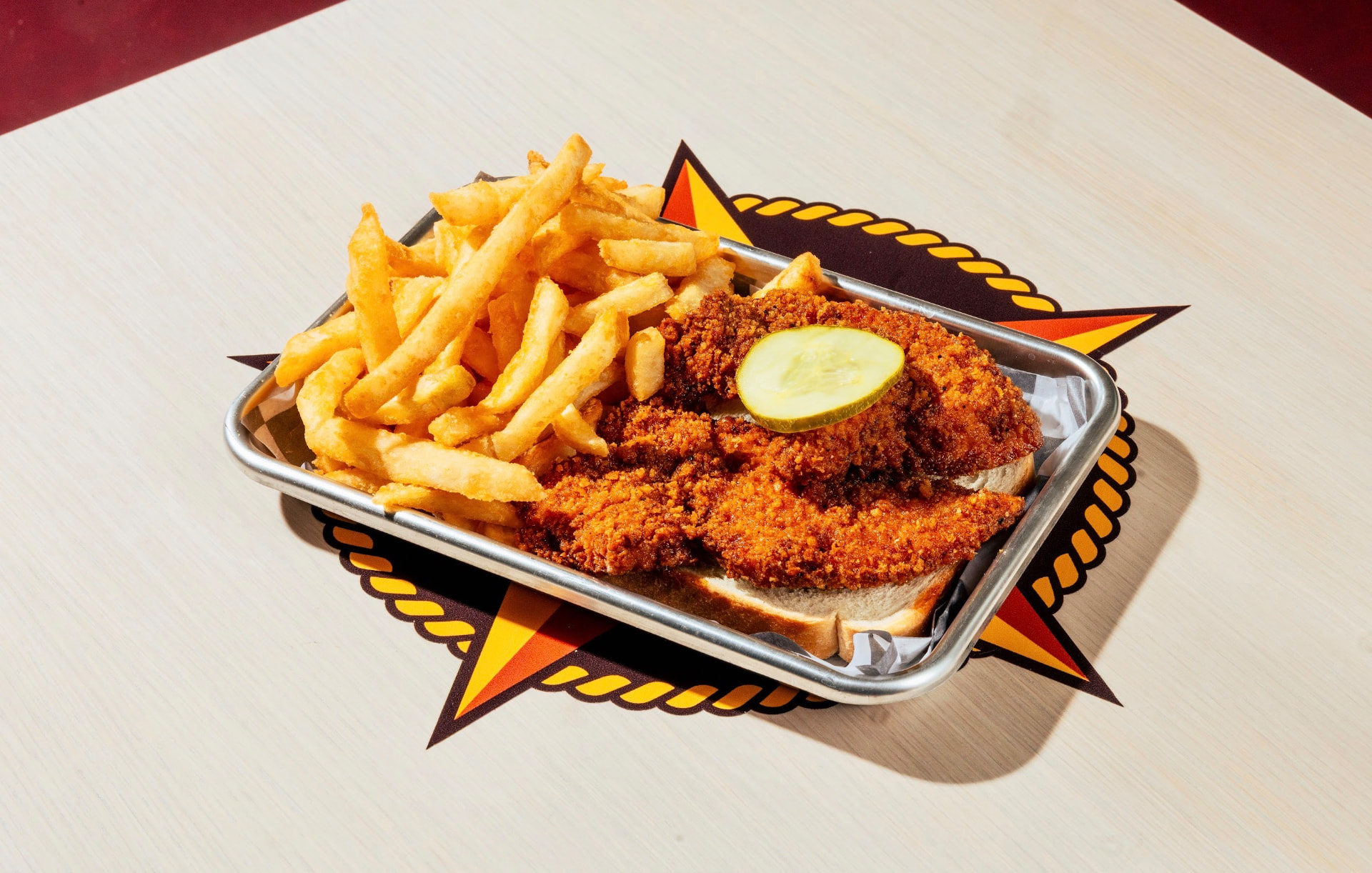 Hot chicken tenders with crinkle-cut fries